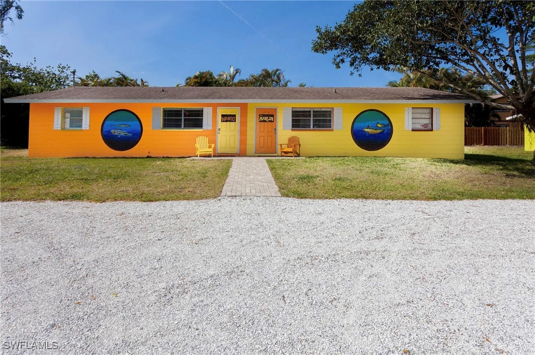 11093 Kelly Road Fort Myers, FL 33908 - Photo 12 of 12 front view of a house with a yard