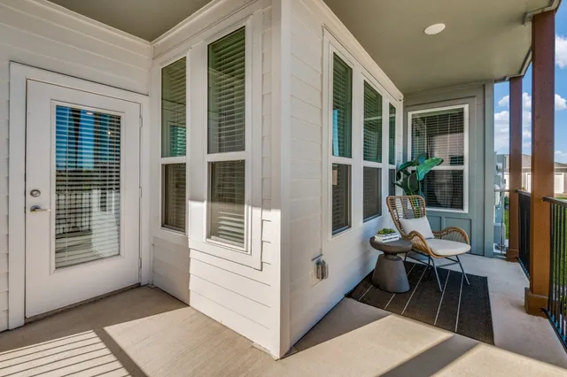a view of swimming pool in front of residential houses with outdoor space