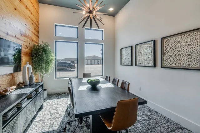 a view of a patio with a chairs and table in a patio