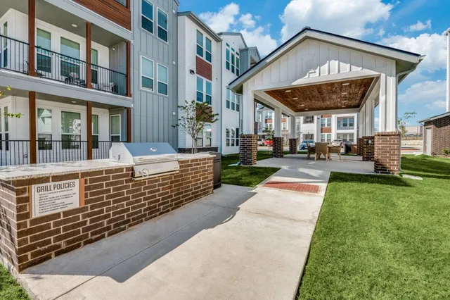 a bathroom with a shower and a sink