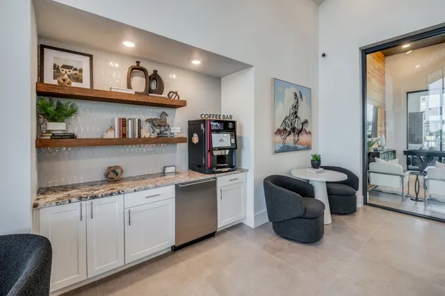 a dining table with chairs and cabinets