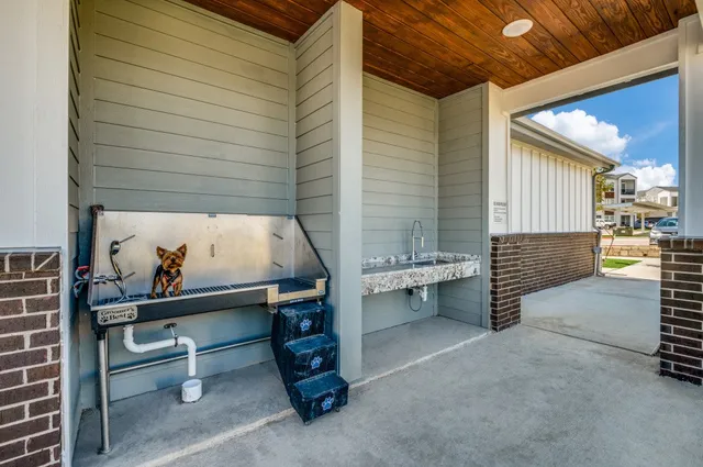 a view of a dining room with furniture and a window