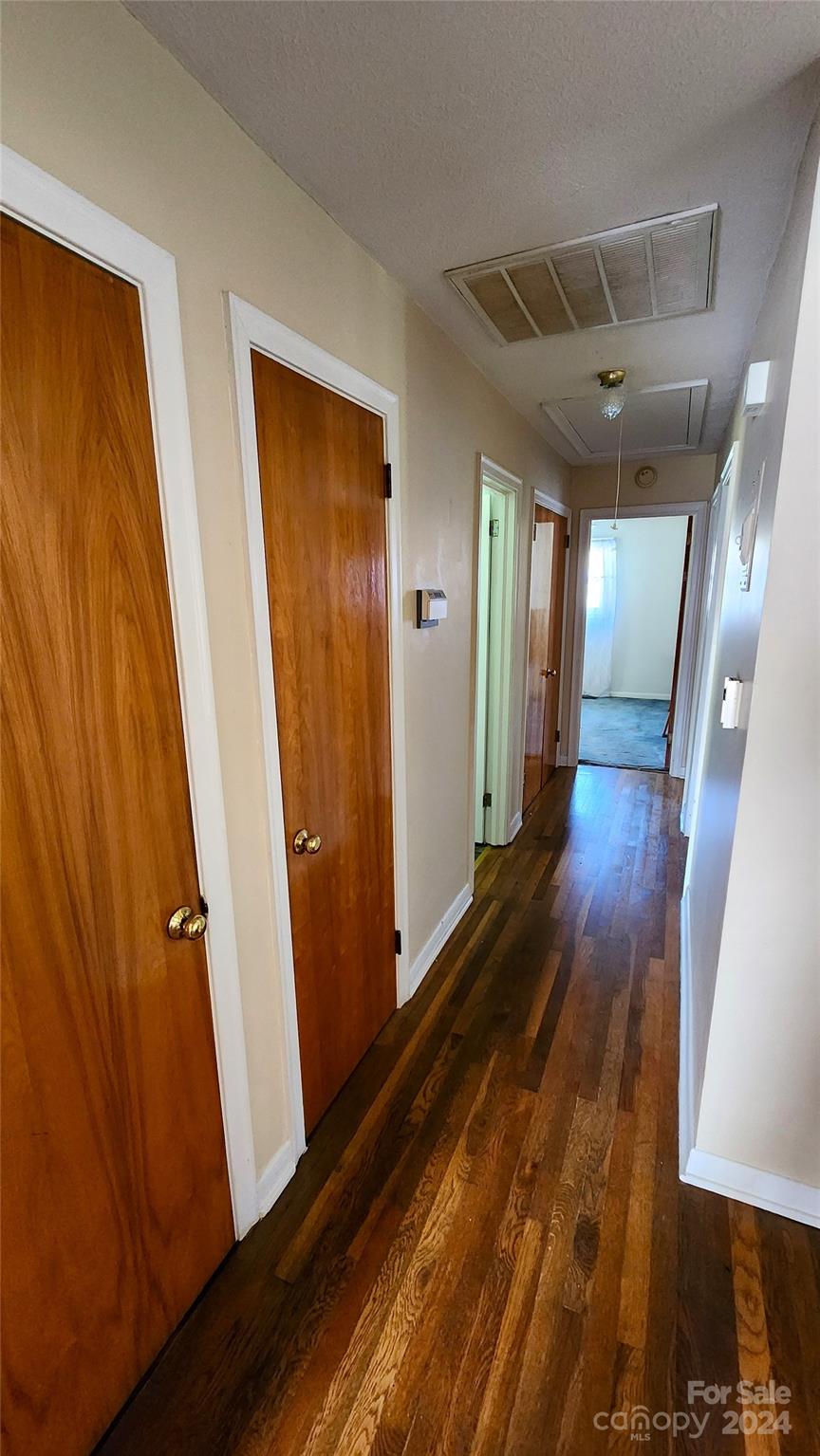108 State Rd S-13-525 Chesterfield, SC 29709 - Photo 31 of 46 a view of a hallway with wooden floor