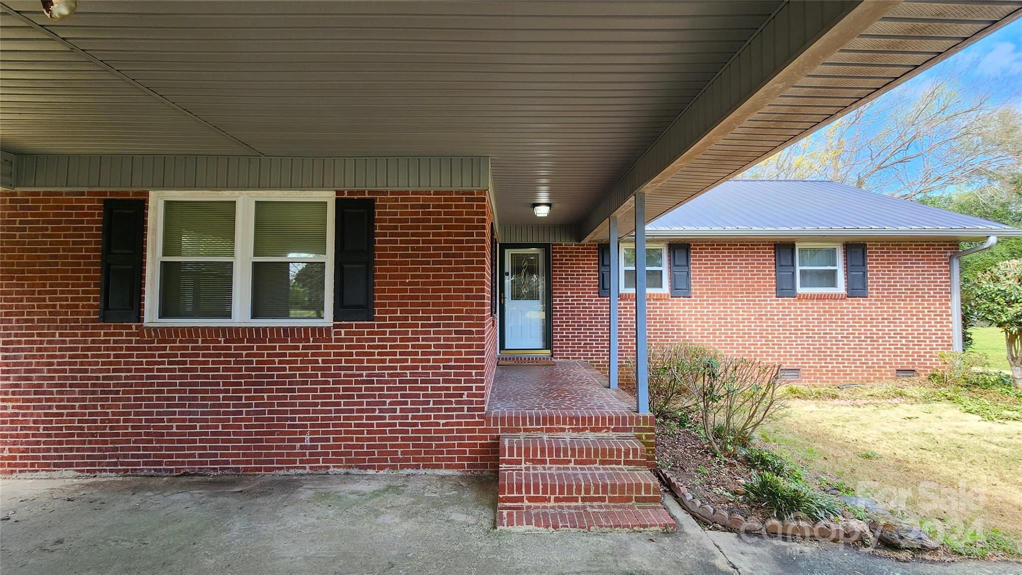 108 State Rd S-13-525 Chesterfield, SC 29709 - Photo 5 of 46 a front view of a house with a garden