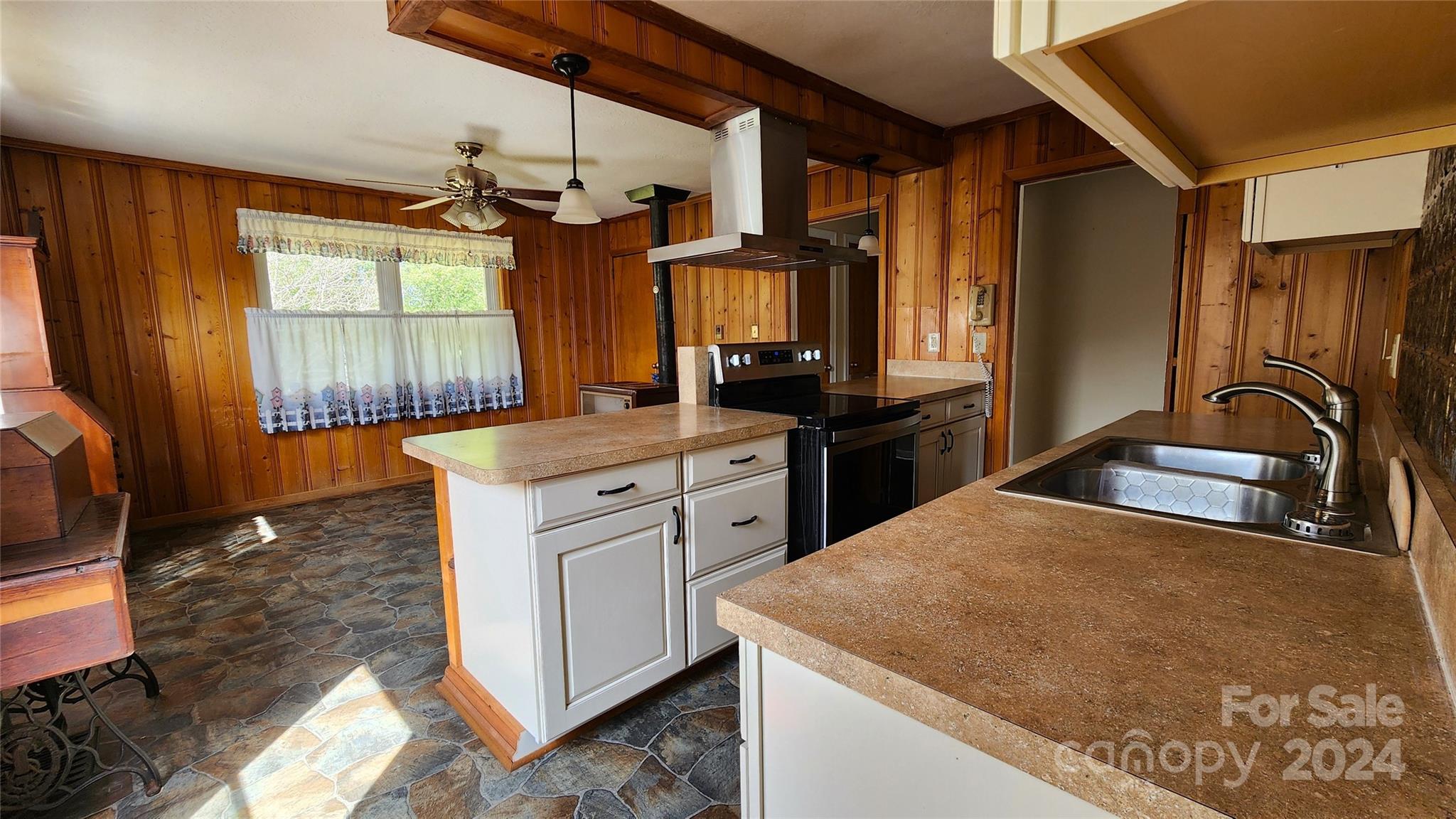 108 State Rd S-13-525 Chesterfield, SC 29709 - Photo 9 of 46 a kitchen with stainless steel appliances granite countertop a sink stove and refrigerator