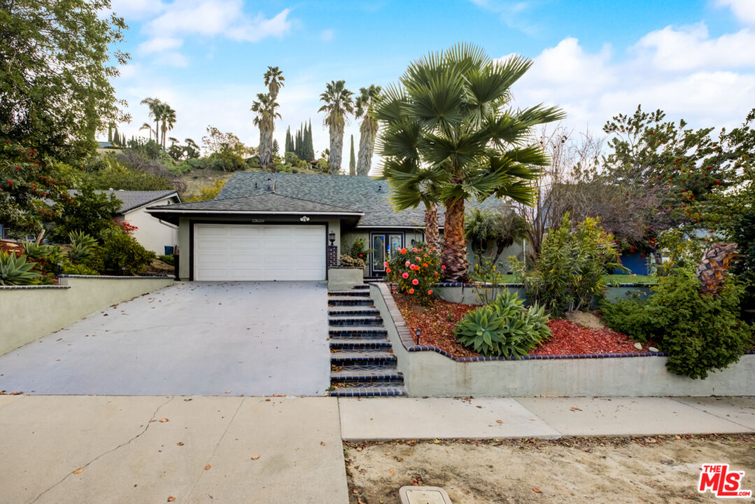 23620 Sunset Crossing Road Diamond Bar, CA 91765 - Photo 11 of 41 a view of a house with a flower garden