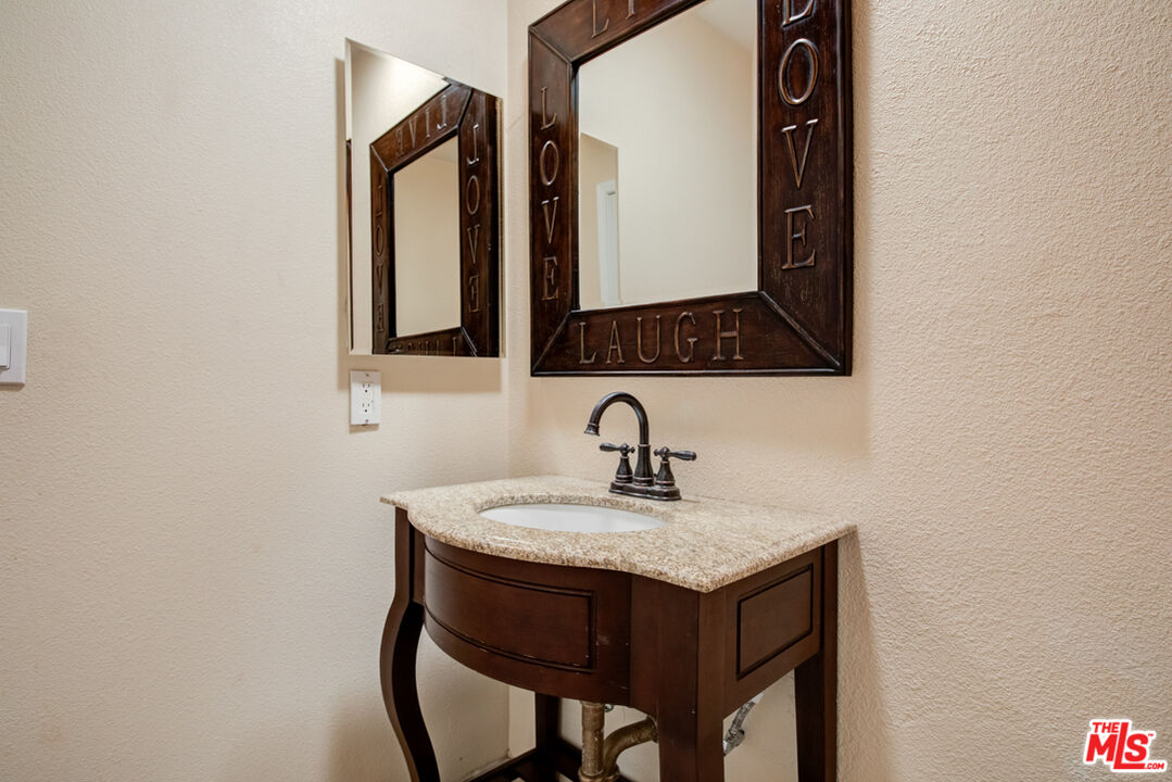 23620 Sunset Crossing Road Diamond Bar, CA 91765 - Photo 23 of 41 a bathroom with a sink and a mirror