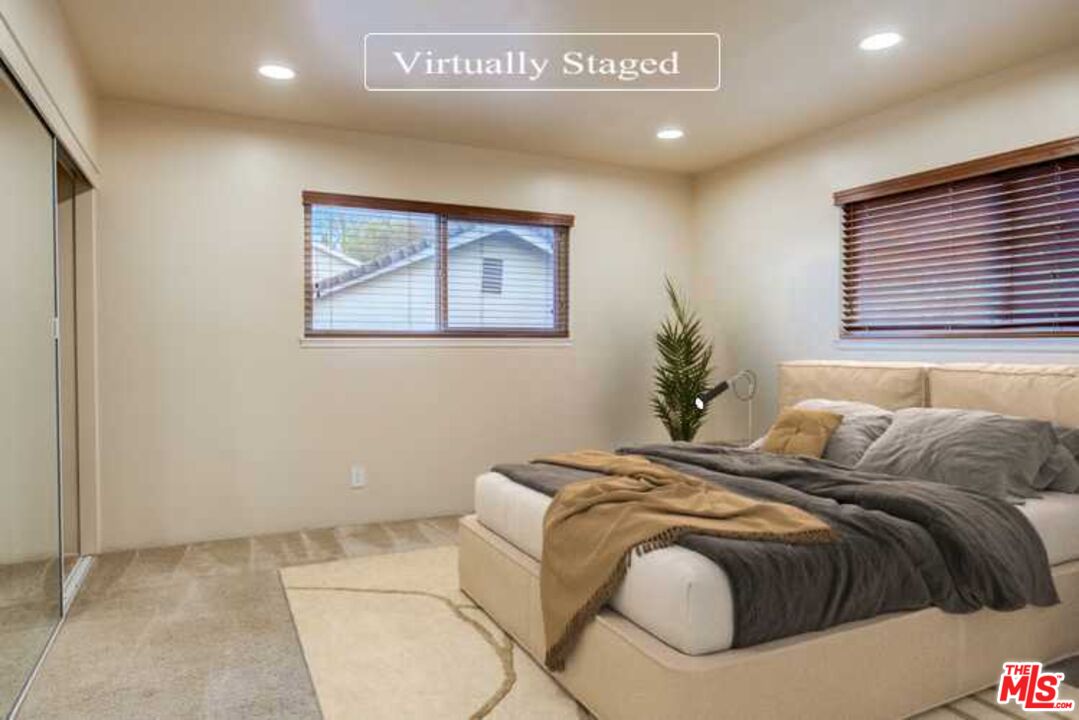 23620 Sunset Crossing Road Diamond Bar, CA 91765 - Photo 3 of 41 a bed sitting in a bedroom next to a window