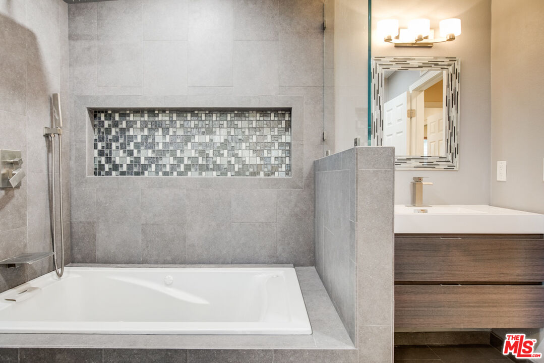 23620 Sunset Crossing Road Diamond Bar, CA 91765 - Photo 33 of 41 a bathroom with a bathtub and a shower