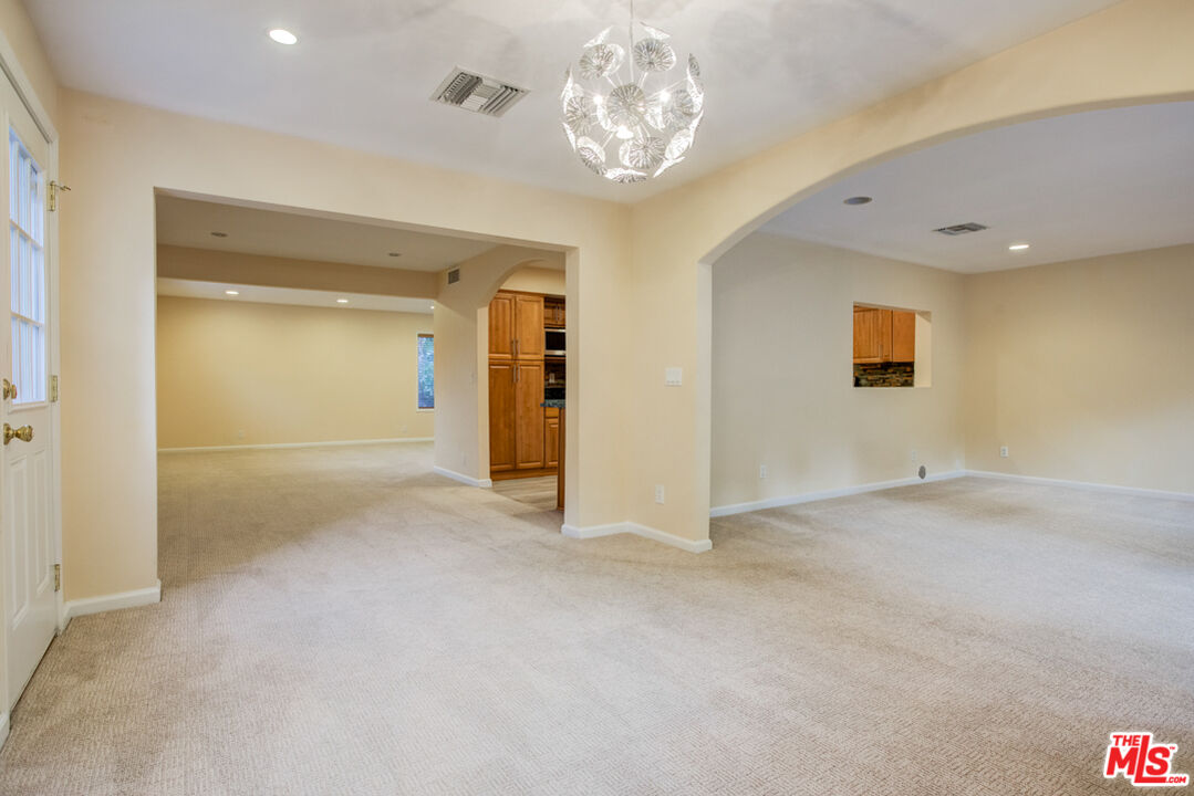 23620 Sunset Crossing Road Diamond Bar, CA 91765 - Photo 5 of 41 en empty room with windows and ceiling fan