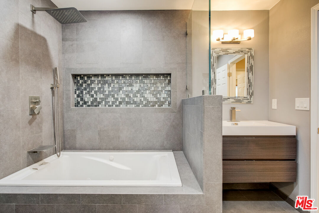 23620 Sunset Crossing Road Diamond Bar, CA 91765 - Photo 7 of 41 a bathroom with a bathtub and a sink
