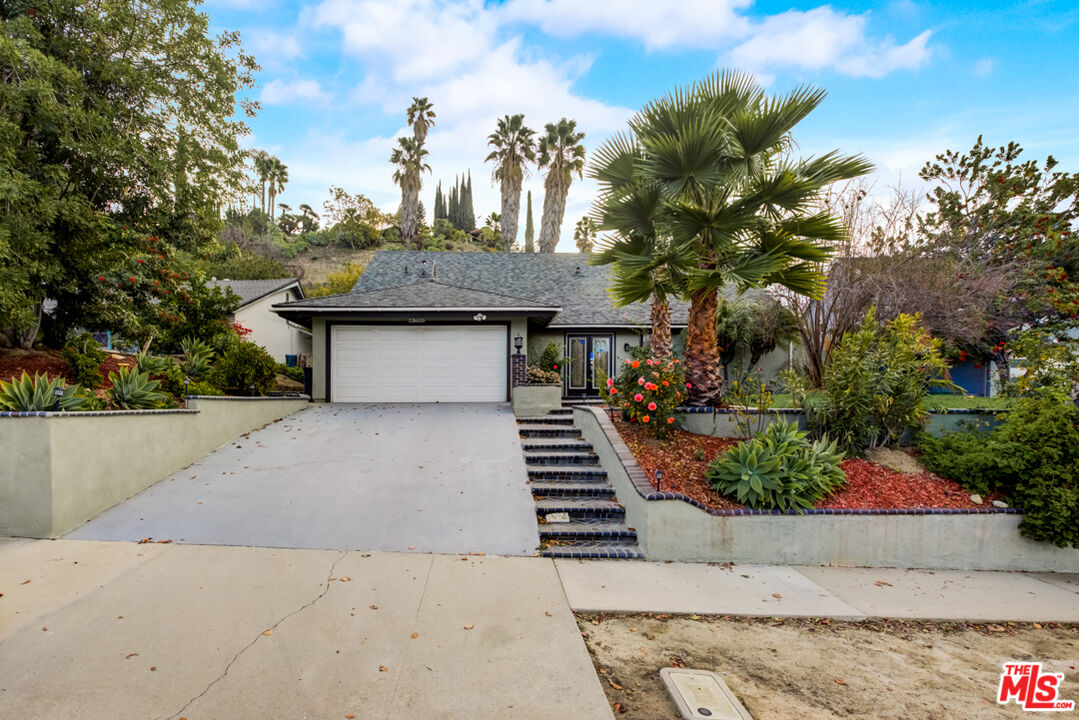 23620 Sunset Crossing Road Diamond Bar, CA 91765 - Photo 9 of 41 a front view of a house with a garden