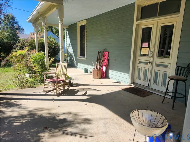 a view of a porch with furniture