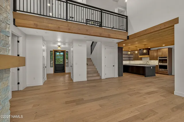 a view of an entryway with wooden floor