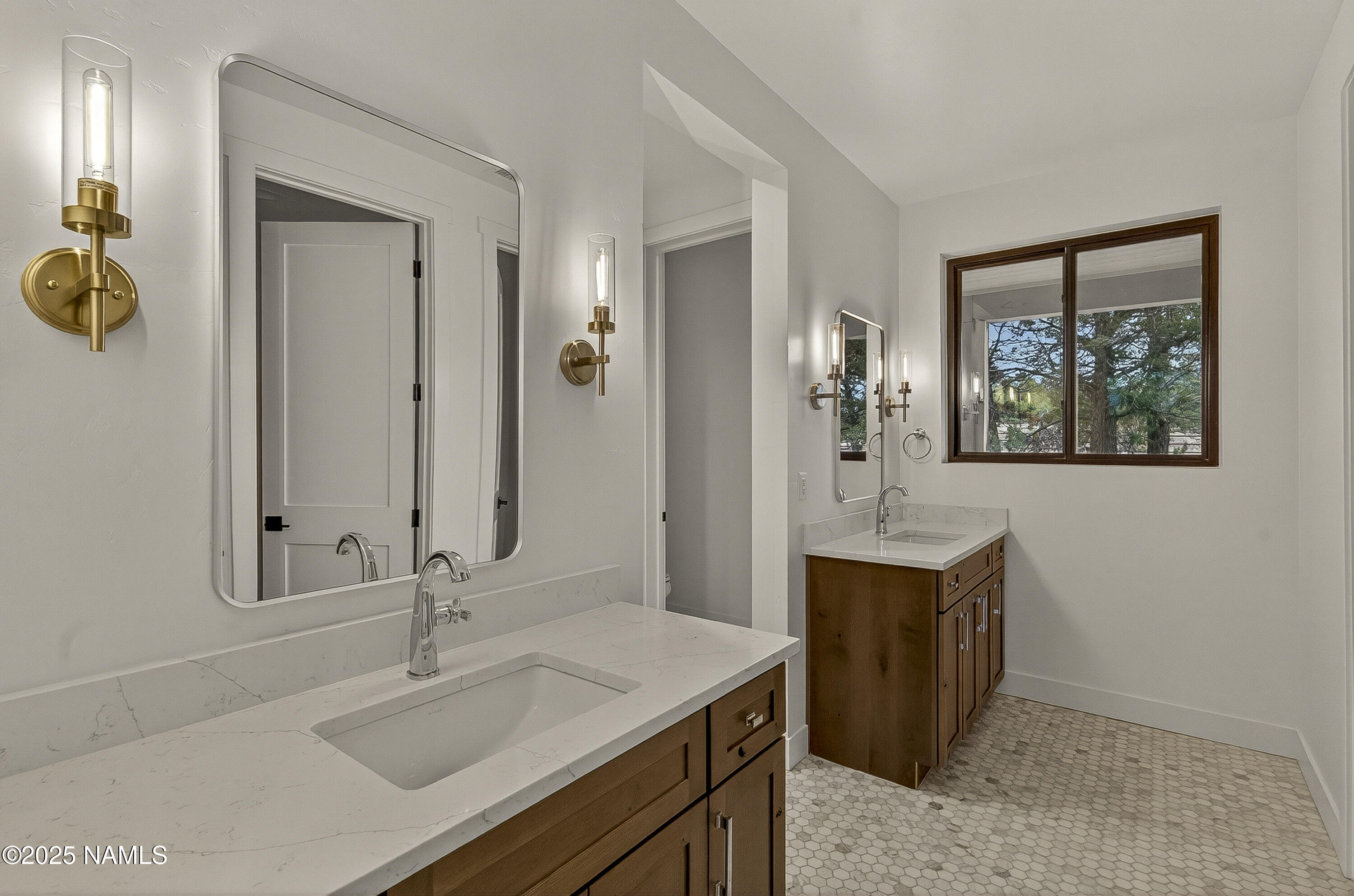 8488 Tall Tales Rnch Road Flagstaff, AZ 86004 - Photo 16 of 52 a bathroom with a sink and a mirror