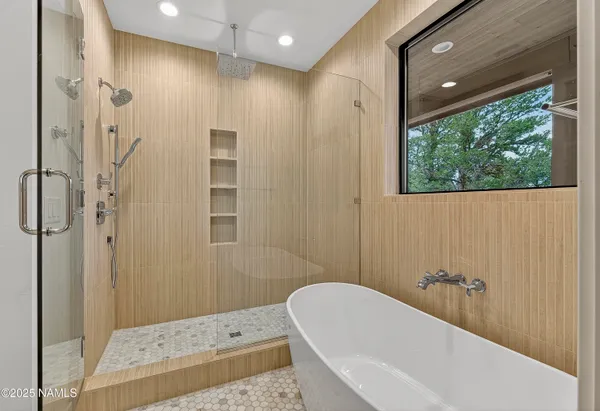 a view of an empty room with glass door and balcony