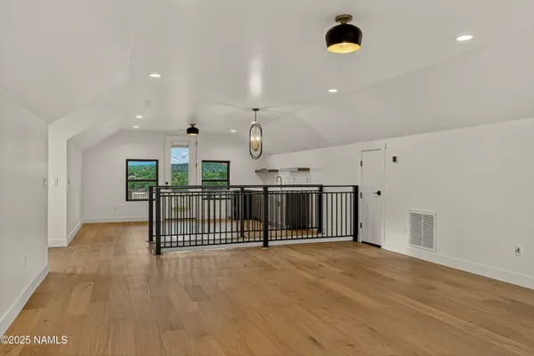 a view of a kitchen with a sink and a window