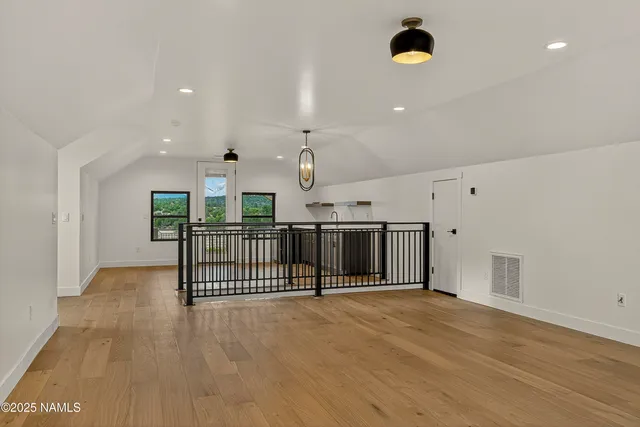 a view of a kitchen with a sink and a window