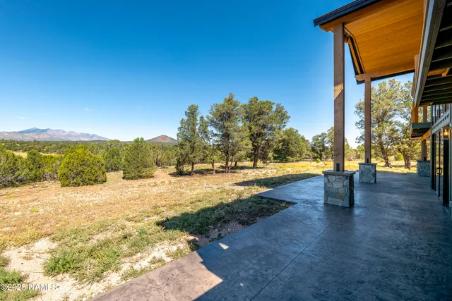 a view of a house with a yard and pool