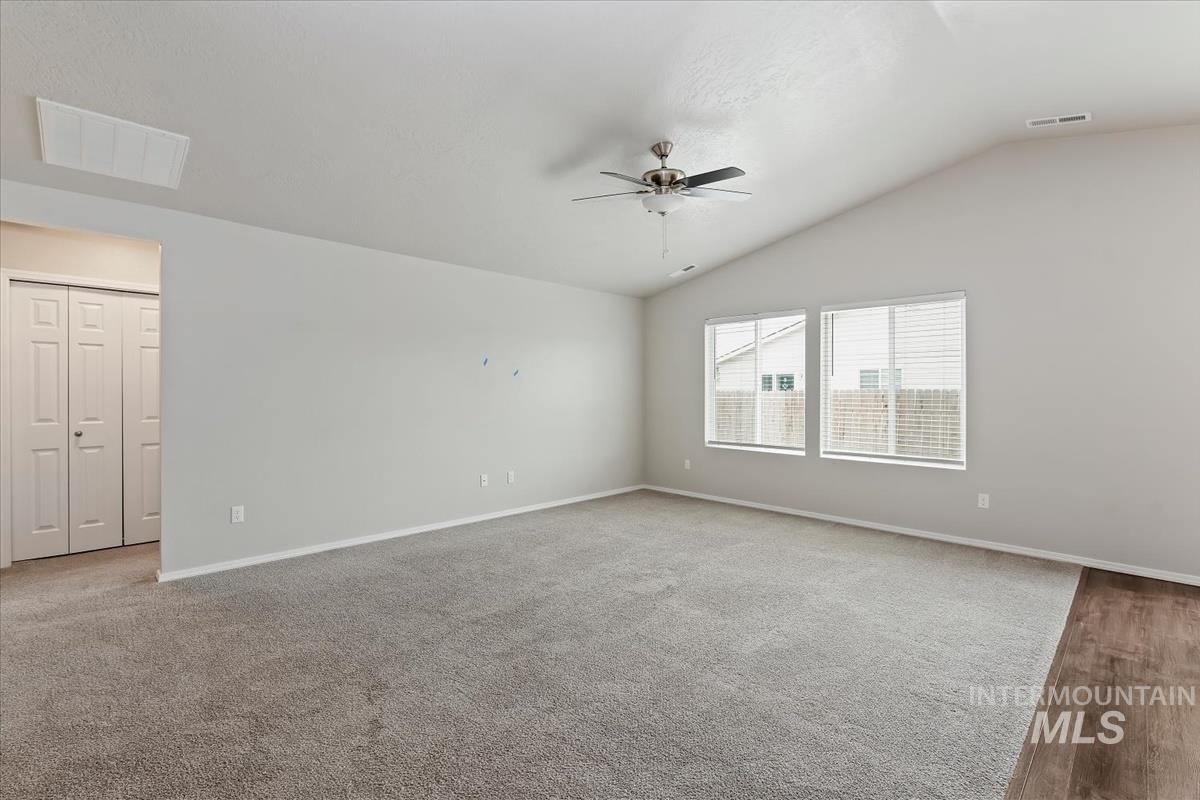 1685 Southwest Levant Way Mountain Home, ID 83647 - Photo 18 of 31 Unfurnished room with a ceiling fan and lofted ceiling