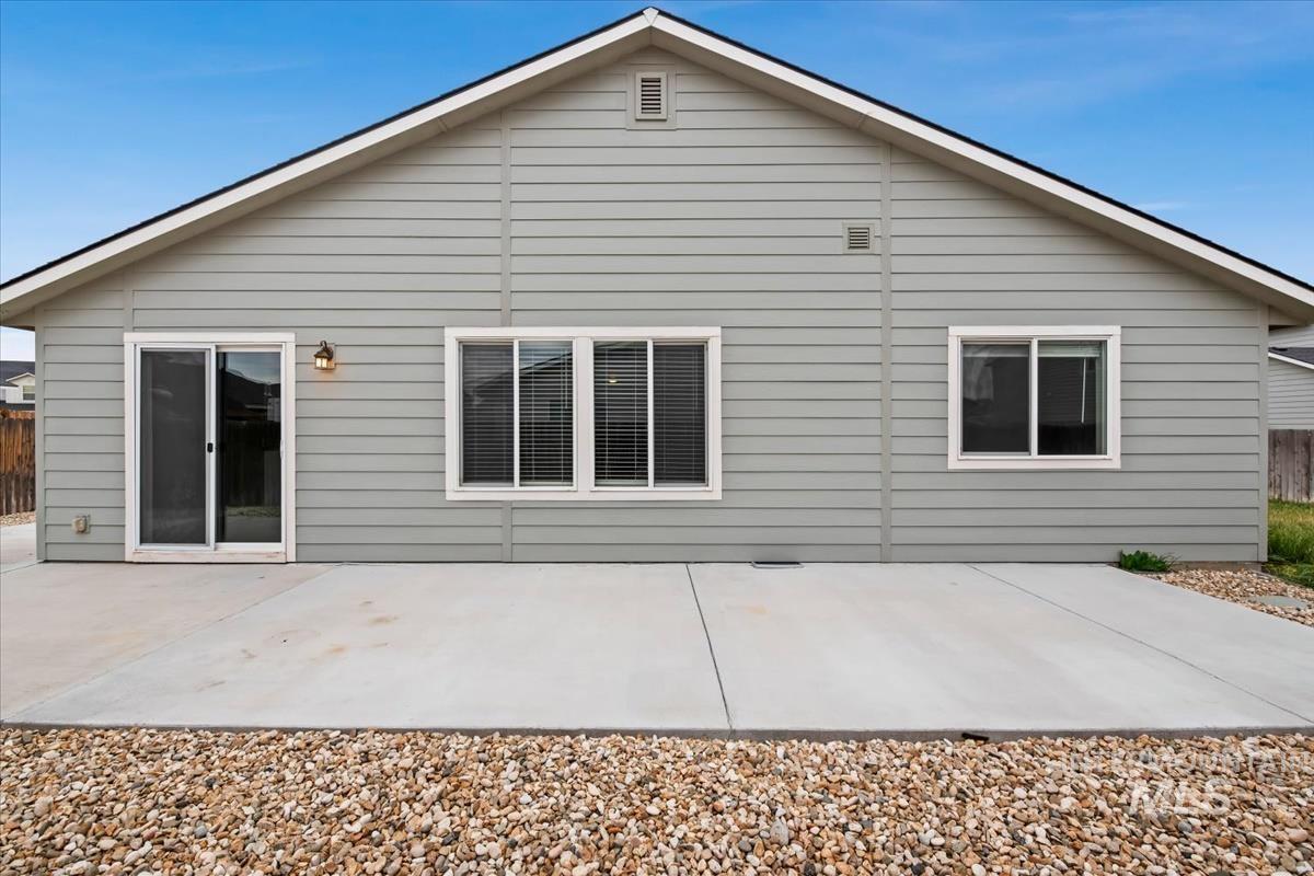 1685 Southwest Levant Way Mountain Home, ID 83647 - Photo 27 of 31 Back of property featuring a patio area