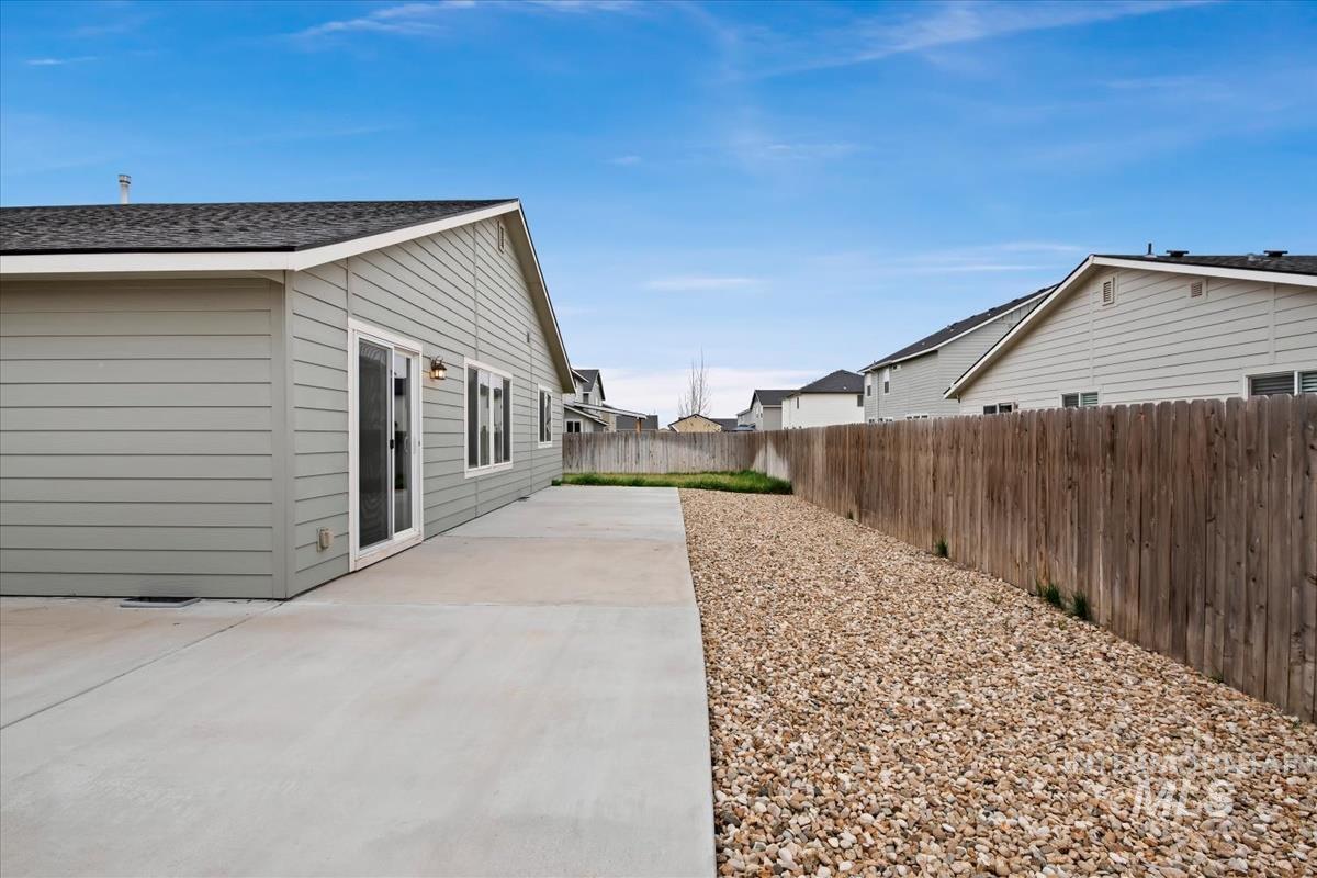 1685 Southwest Levant Way Mountain Home, ID 83647 - Photo 28 of 31 Fenced backyard featuring a patio area
