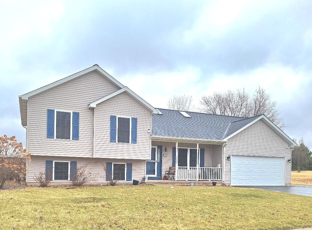 602 Sandra Street Kingston, IL 60145 - Photo 1 of 9 a front view of a house with a lots of large windows
