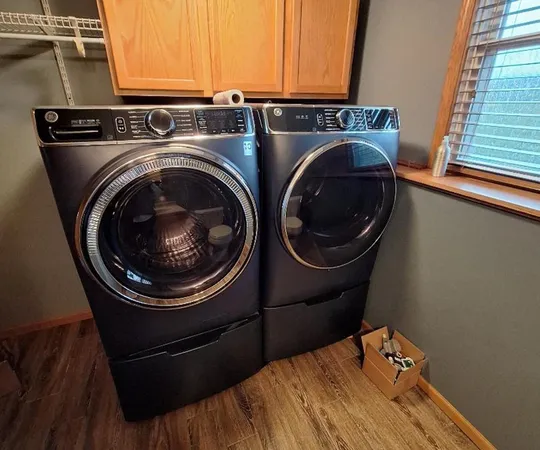 a view of a house with backyard and porch