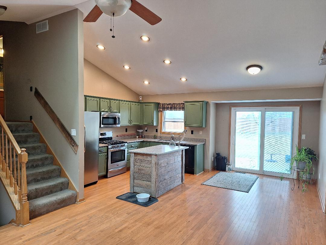 602 Sandra Street Kingston, IL 60145 - Photo 2 of 9 a kitchen with stainless steel appliances granite countertop a refrigerator and a stove top oven