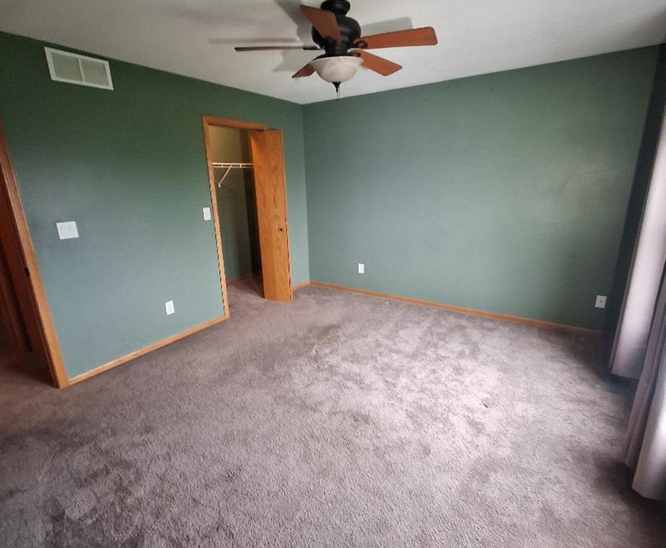 602 Sandra Street Kingston, IL 60145 - Photo 4 of 18 a view of an empty room with a ceiling fan