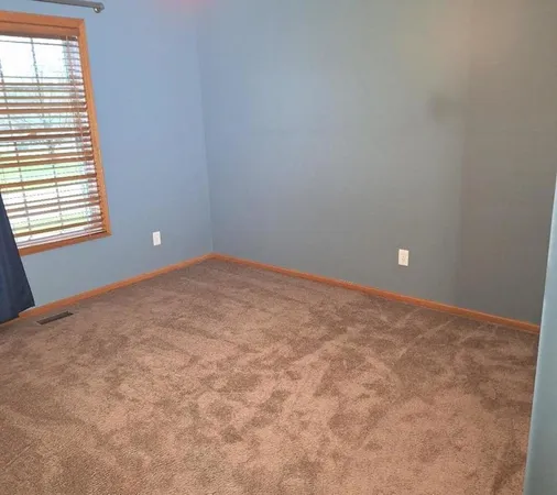 a living room with a fireplace and a flat screen tv
