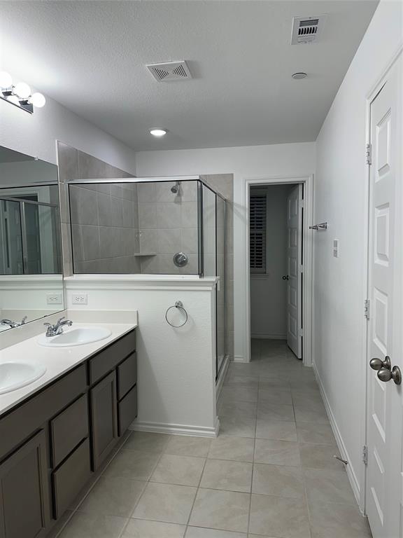 3004 Baneberry Lane, Unit 43 Mesquite, TX 75150 - Photo 16 of 16 a bathroom with a sink a toilet and mirror