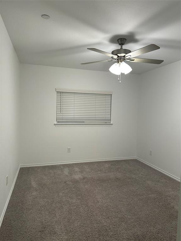 3004 Baneberry Lane, Unit 43 Mesquite, TX 75150 - Photo 8 of 16 an empty room with a window and a fan