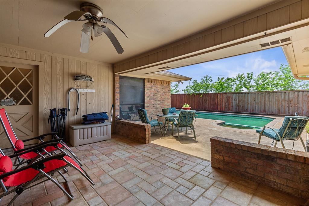 1502 Hinchliffe Road Mexia, TX 76667 - Photo 31 of 40 View of patio / terrace featuring a fenced backyard, a ceiling fan, a fenced in pool, and outdoor dining space