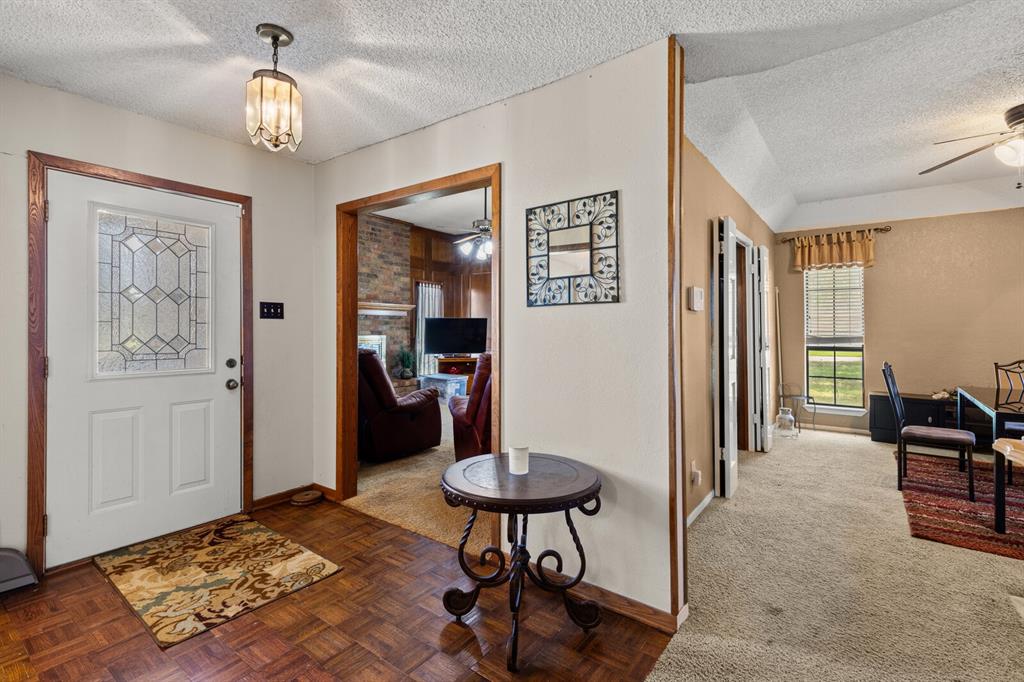 1502 Hinchliffe Road Mexia, TX 76667 - Photo 38 of 40 Foyer entrance featuring a ceiling fan, baseboards, and a textured ceiling