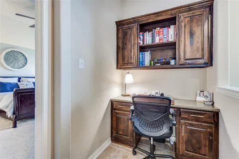 a view of a hallway with paintings on the wall