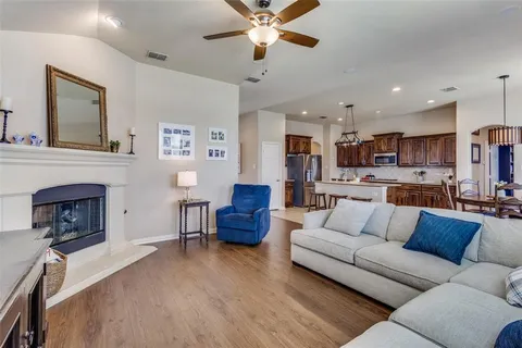 a living room with furniture and fireplace