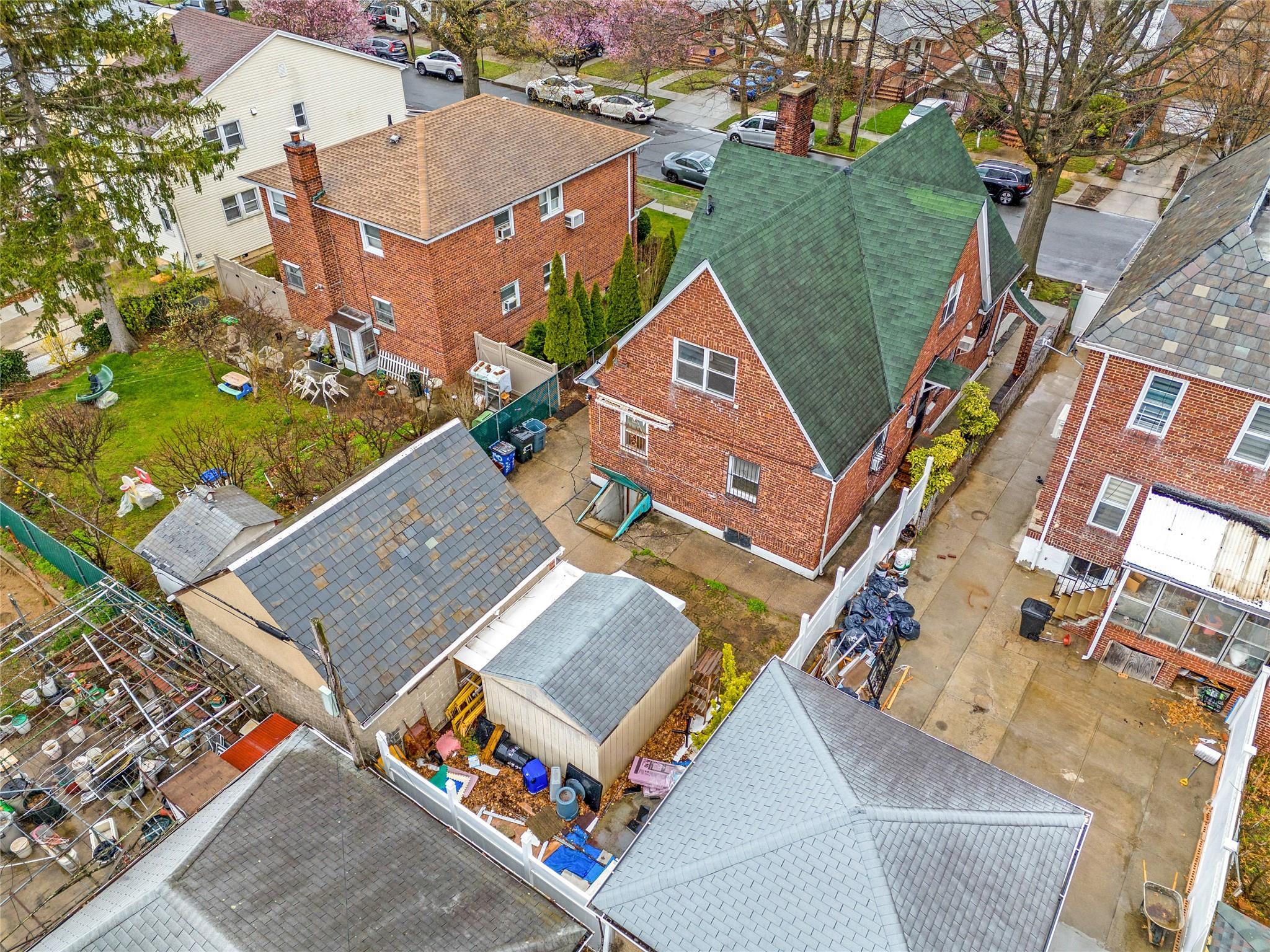 140-50 Quince Avenue Queens, NY 11355 - Photo 7 of 13 an aerial view of a house with a yard