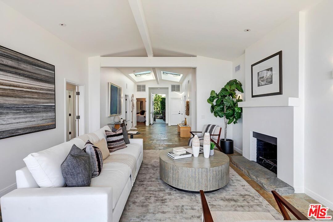 18106 Wakecrest Drive Malibu, CA 90265 - Photo 8 of 29 a living room with furniture and a fireplace