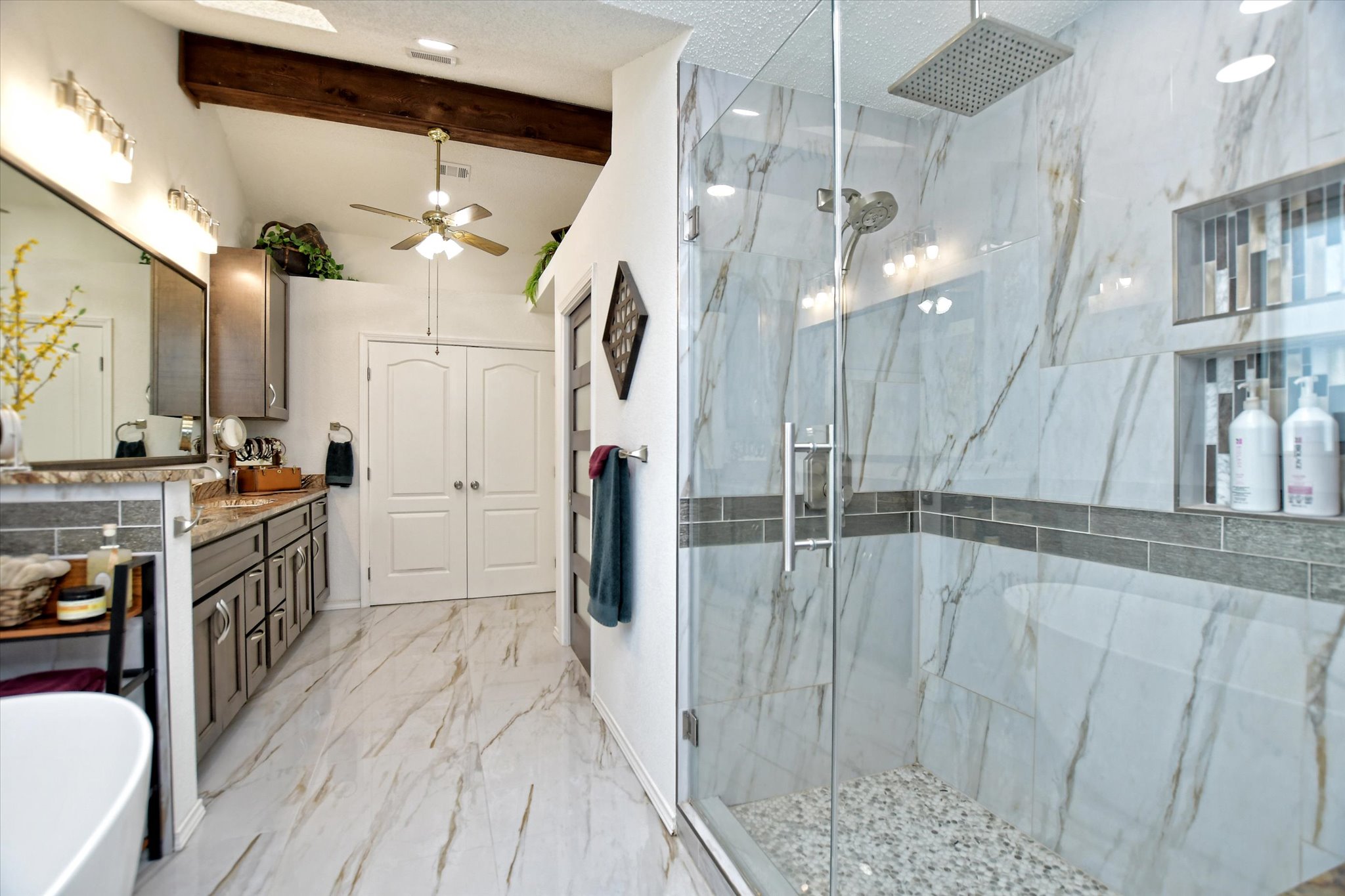 1002 West Noton Street Pflugerville, TX 78660 - Photo 2 of 32 Amazing primary bathroom with large walk-in shower and a soaking tub