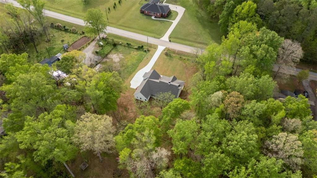 11691 Hazelbrand Road Northeast Covington, GA 30014 - Photo 46 of 53 an aerial view of a house with a yard and garden