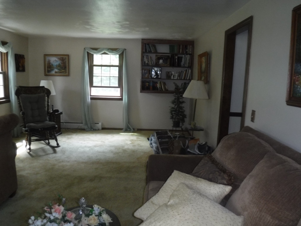 21 Old Orchard Road Hampden, MA 01036 - Photo 8 of 21 a living room with furniture and a rug
