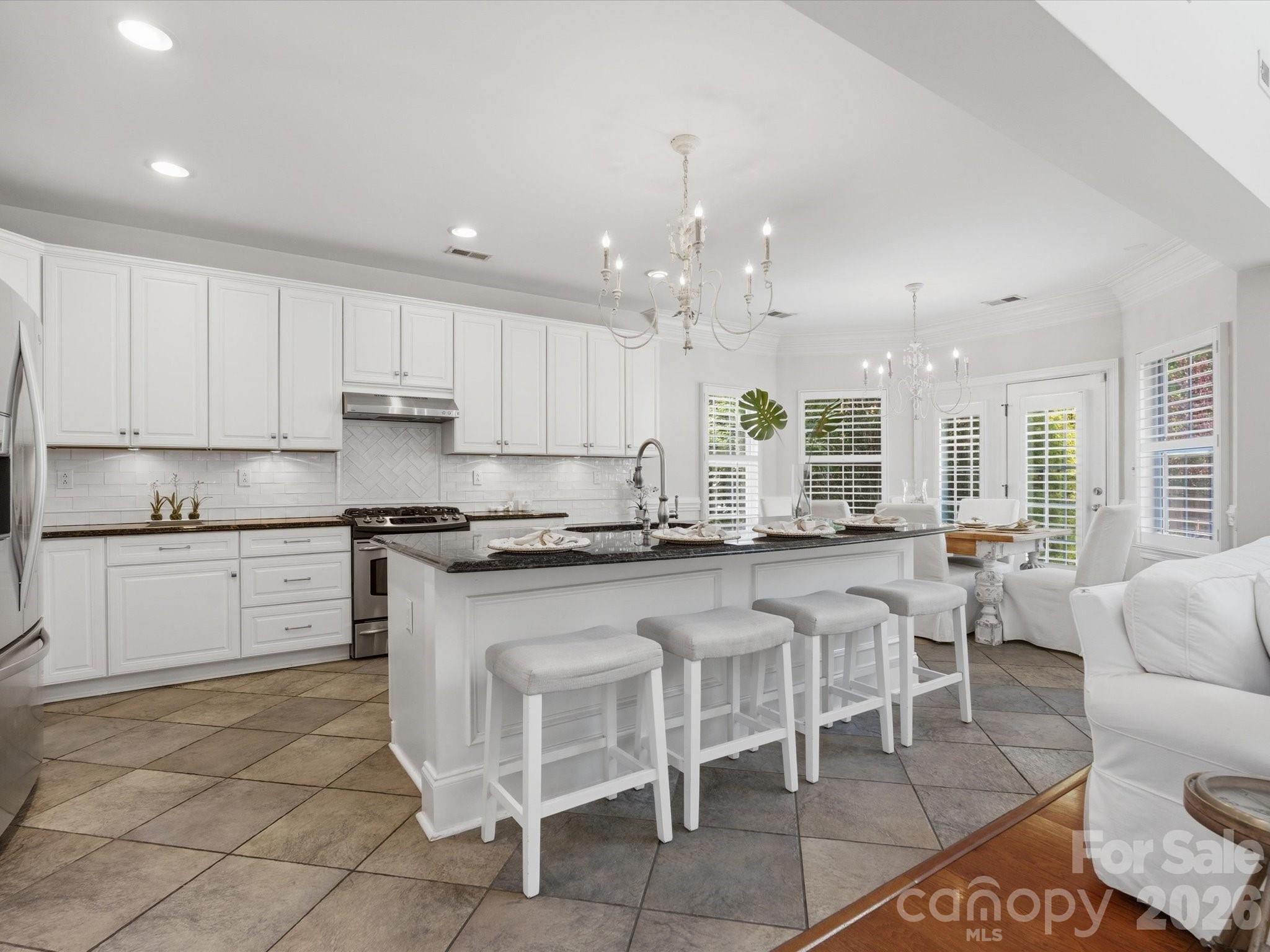 1026 Spanish Moss Road Indian Trail, NC 28079 - Photo 12 of 44 a large kitchen with lots of counter space and appliances
