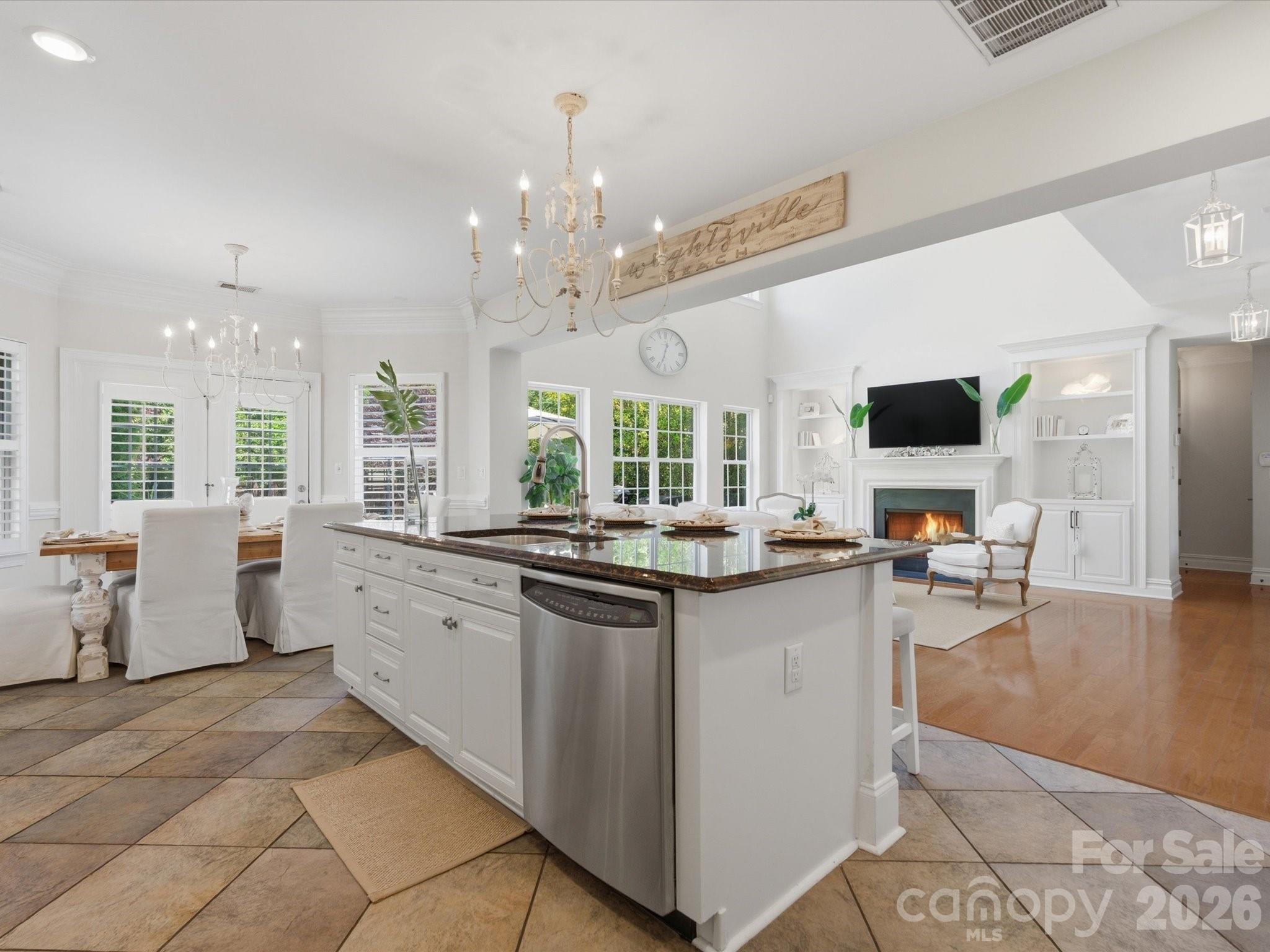 1026 Spanish Moss Road Indian Trail, NC 28079 - Photo 15 of 44 a kitchen with lots of counter top space and living room