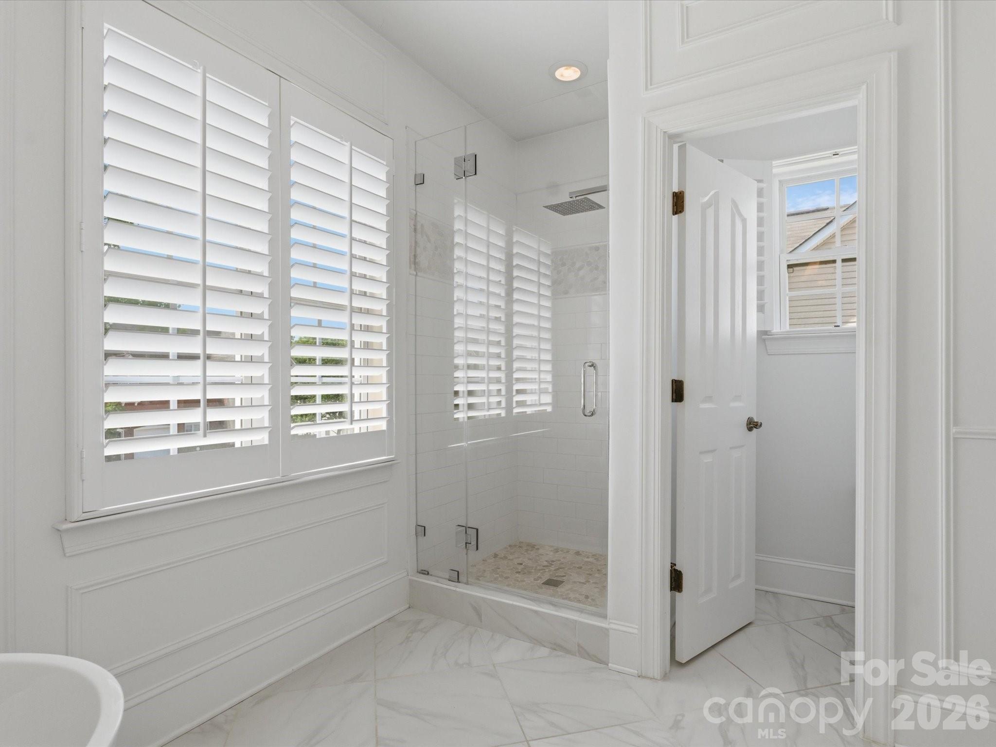 1026 Spanish Moss Road Indian Trail, NC 28079 - Photo 27 of 44 a bathroom with a shower and a toilet