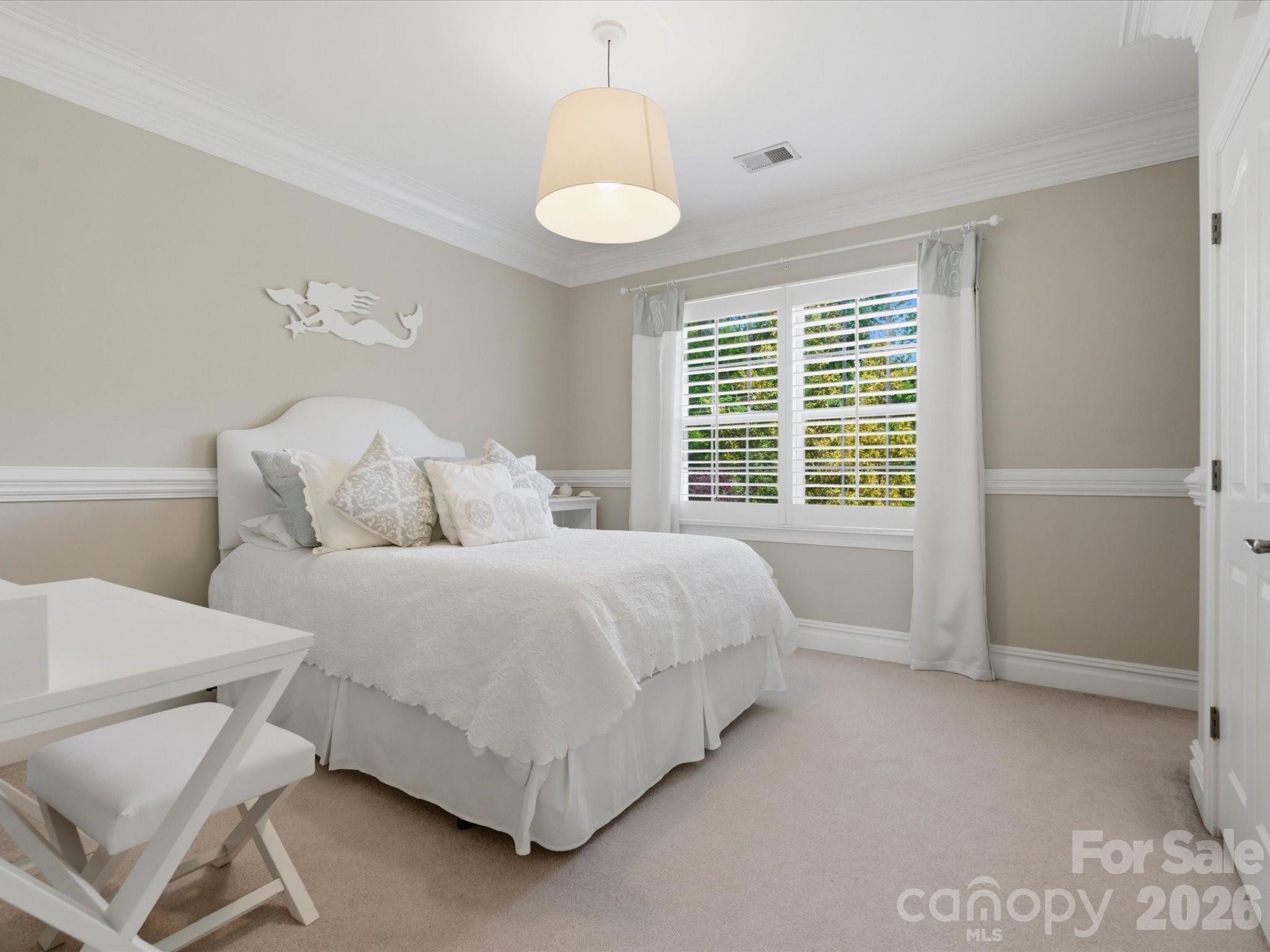 1026 Spanish Moss Road Indian Trail, NC 28079 - Photo 30 of 44 a spacious bedroom with a bed and a window