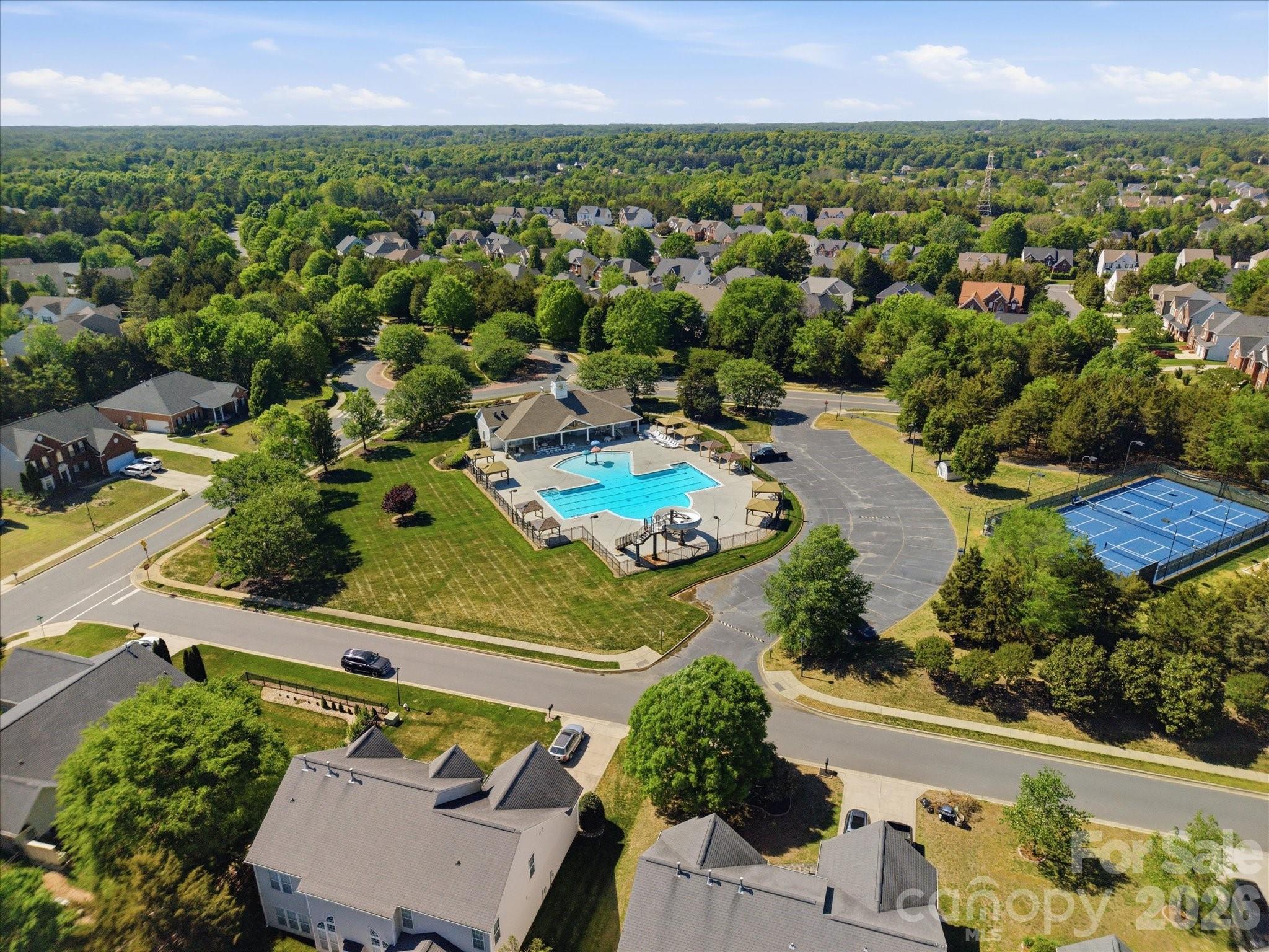 1026 Spanish Moss Road Indian Trail, NC 28079 - Photo 43 of 44 an aerial view of residential houses with outdoor space and trees