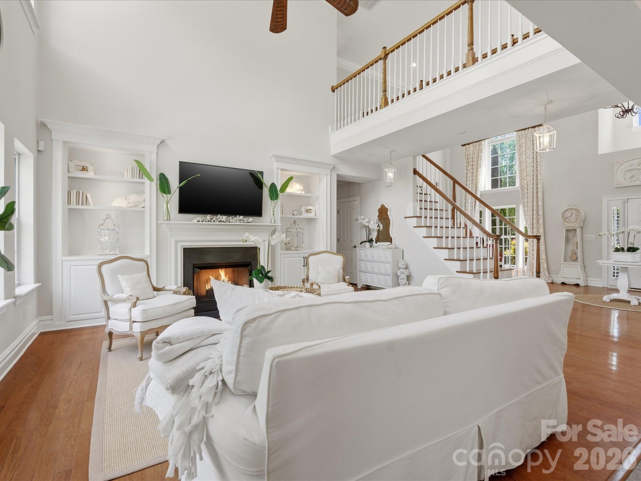 1026 Spanish Moss Road Indian Trail, NC 28079 - Photo 10 of 44 a living room with furniture a fireplace and a flat screen tv