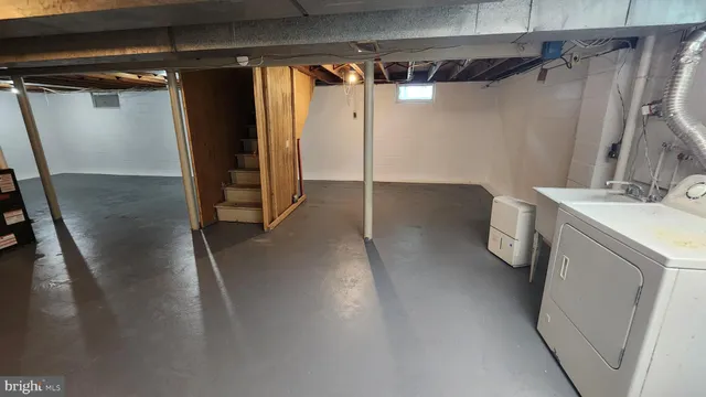 a view of a storage & utility room with a sink