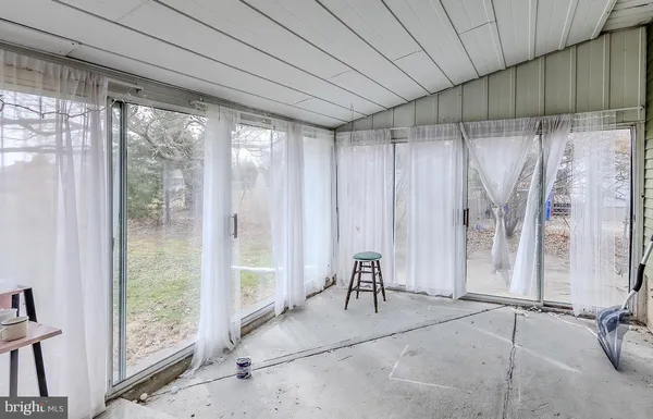 a view of a room with a couch and a table chair